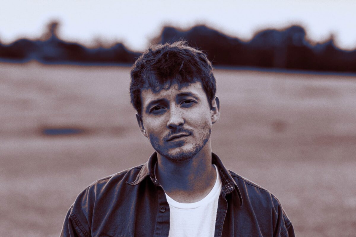 monochrome portrait of a man outdoors.