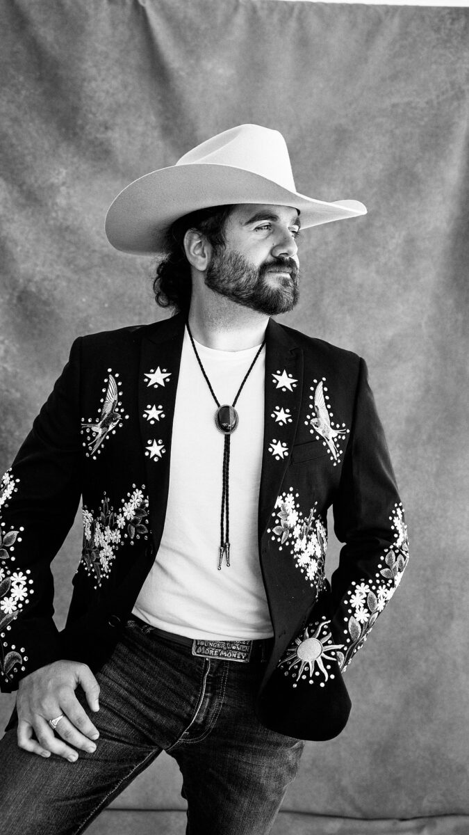 Man posing in cowboy hat