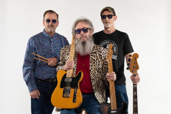 three musicians on white background with guitars