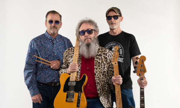 three musicians on white background with guitars