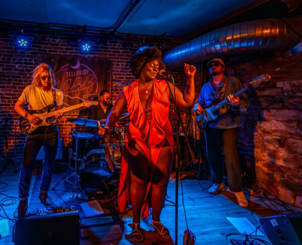 woman in red dress on stage
