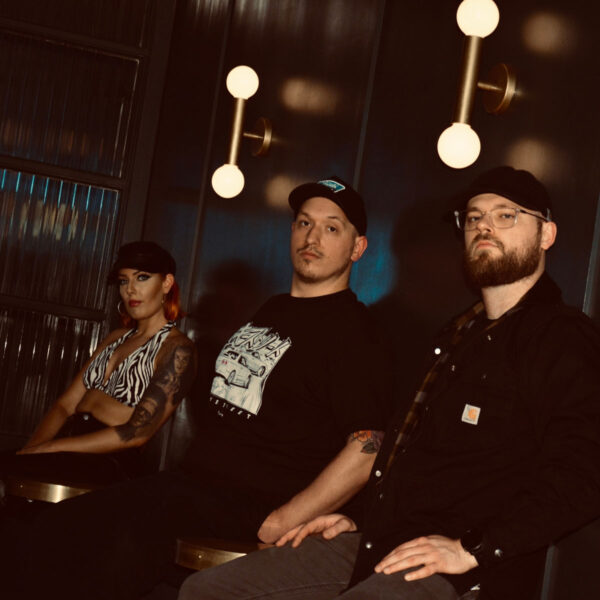 two men and woman music group